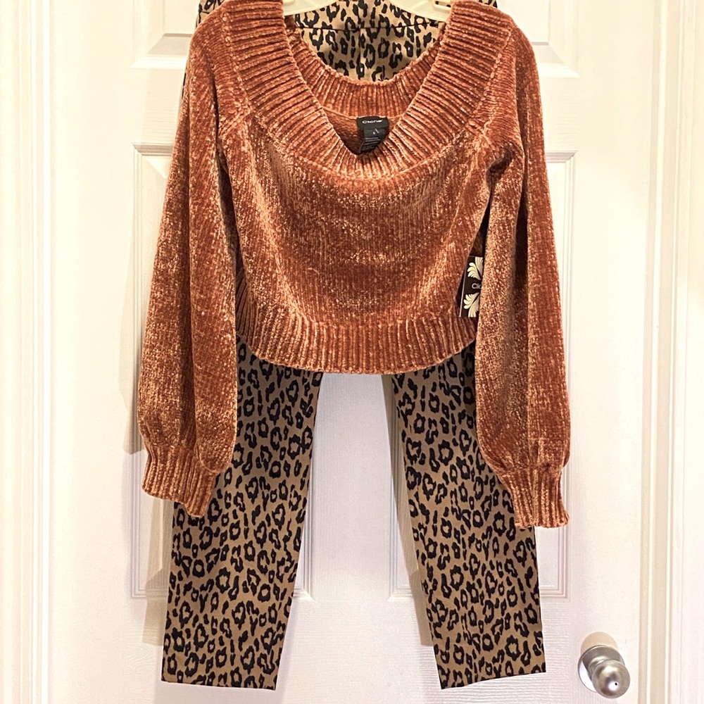 Cliche’ off the shoulder crop sweater.